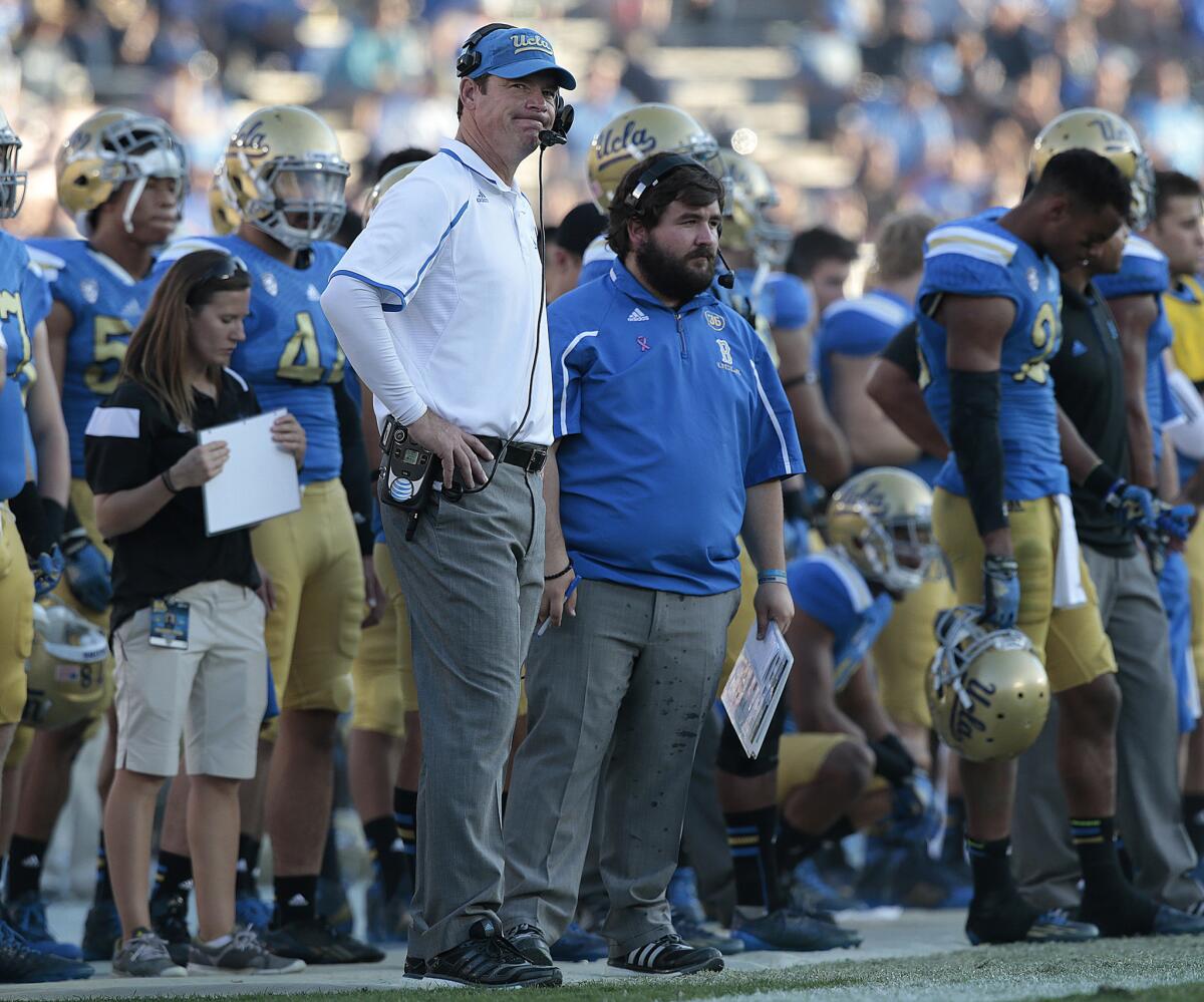A frustated UCLA Coach Jim Mora looks up at the scoreboard late in a 31-10 loss to Stanford Nov. 28 at the Rose Bowl.