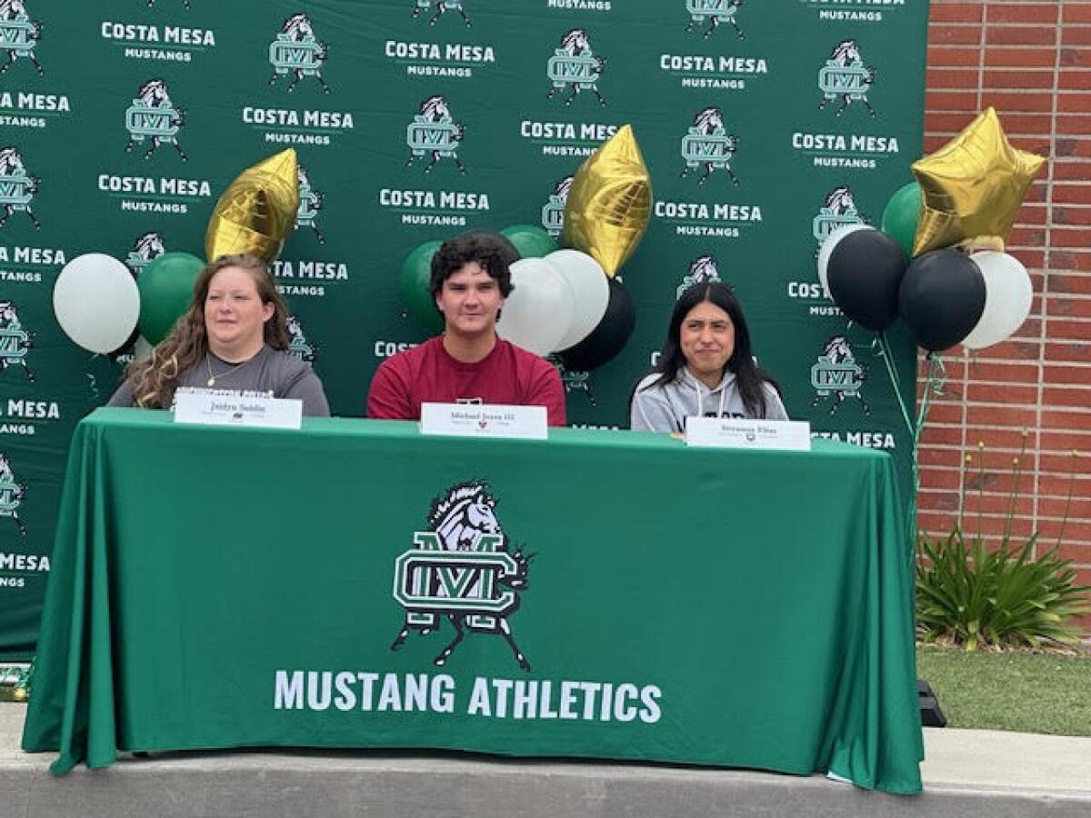 Costa Mesa's Jaidyn Soldin, Michael Joyce III, and Bryanna Elias participate in a signing day event on May 15.