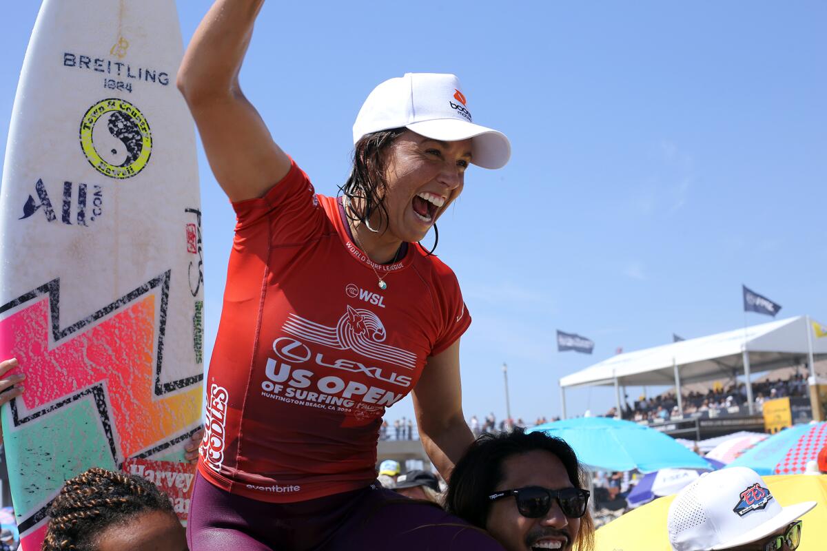 Sally Fitzgibbons of Australia celebrates after winning the women's final at the U.S. Open of Surfing on Sunday.