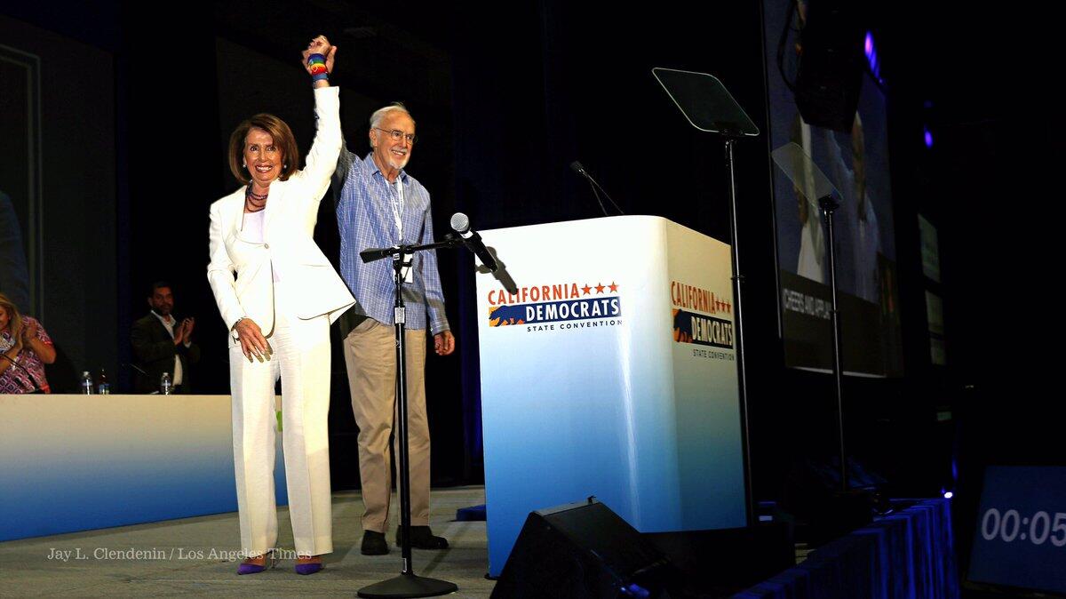 House Minority Leader Nancy Pelosi joins California Democratic Party Chairman John Burton at the party convention in Sacramento.