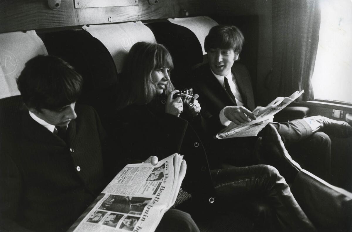 From left, Ringo Starr, Astrid Kirchherr and John Lennon on a train during the filming of "A Hard Day's Night."