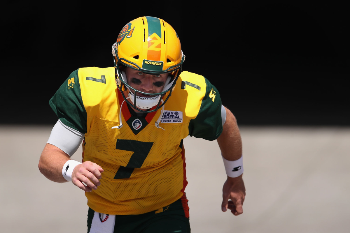 Arizona Hotshots quarterback John Wolford runs onto the field.