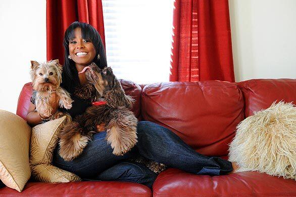 Actress Keshia Knight Pulliam with her dogs Kunta Kinte, left, and Chip at her home in Atlanta on Jan. 30, 2009. Pulliam is in the upcoming movie "Tyler Perry's Madea Goes to Jail."