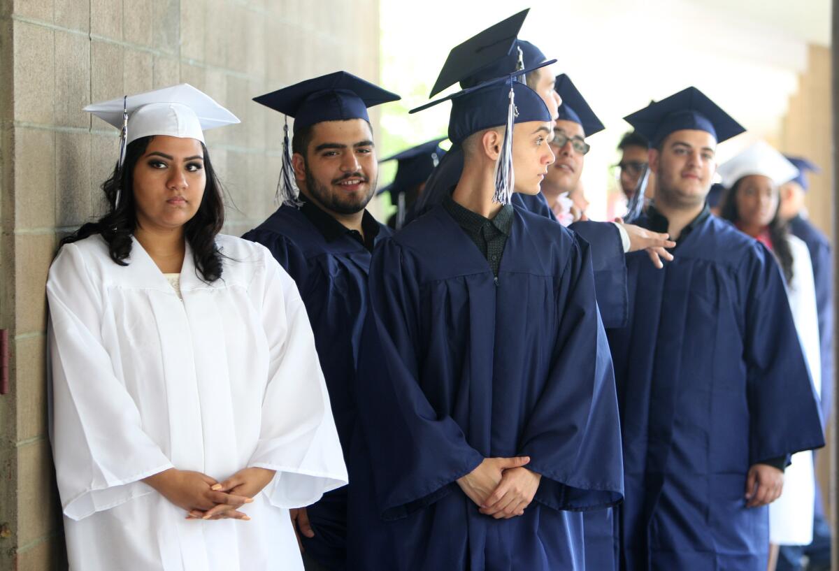 Students wait patiently for commencement exercises to begin for Daily High School, Re-Connected Glendale and Verdugo Academy at First United Methodist Church in Glendale on Wednesday, June 1, 2016.