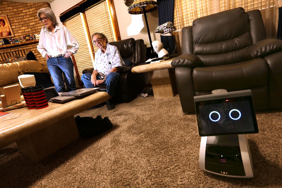 Audrey Mattlin and her husband, Ken, spend time in their living room in Bakersfield.