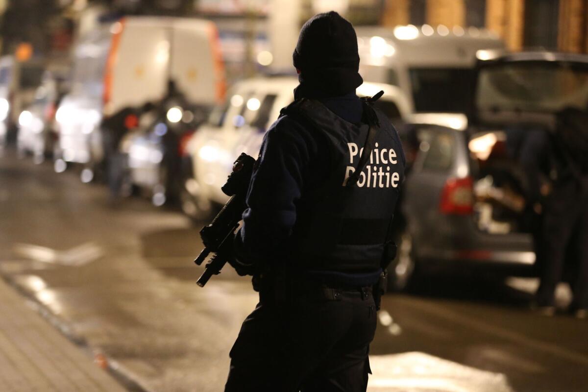 Police officers take part in an operation in Brussels last month. Six people were arrested in a series of raids in the Belgian capital, the federal prosecutor's office said.