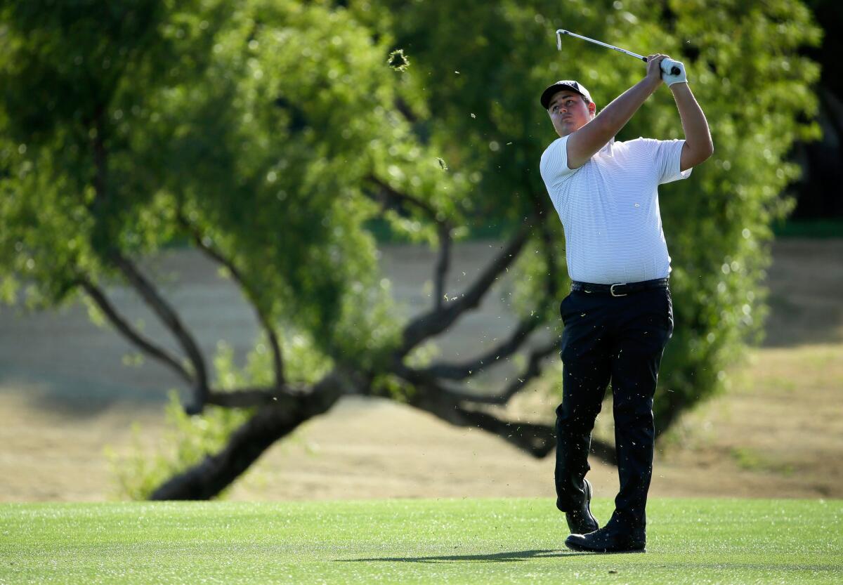 Michael Putnam takes his second shot on the 18th hole during the first round of the Humana Challenge in La Quinta.