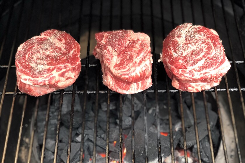 Beef ribeye cap steaks from Costco on the grill.