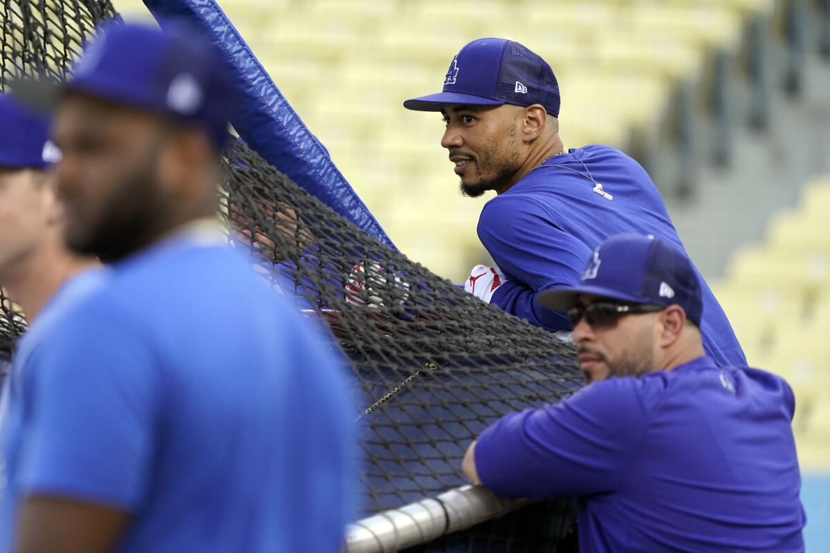 Mookie Betts watches Dodgers batting practice on Oct. 7.