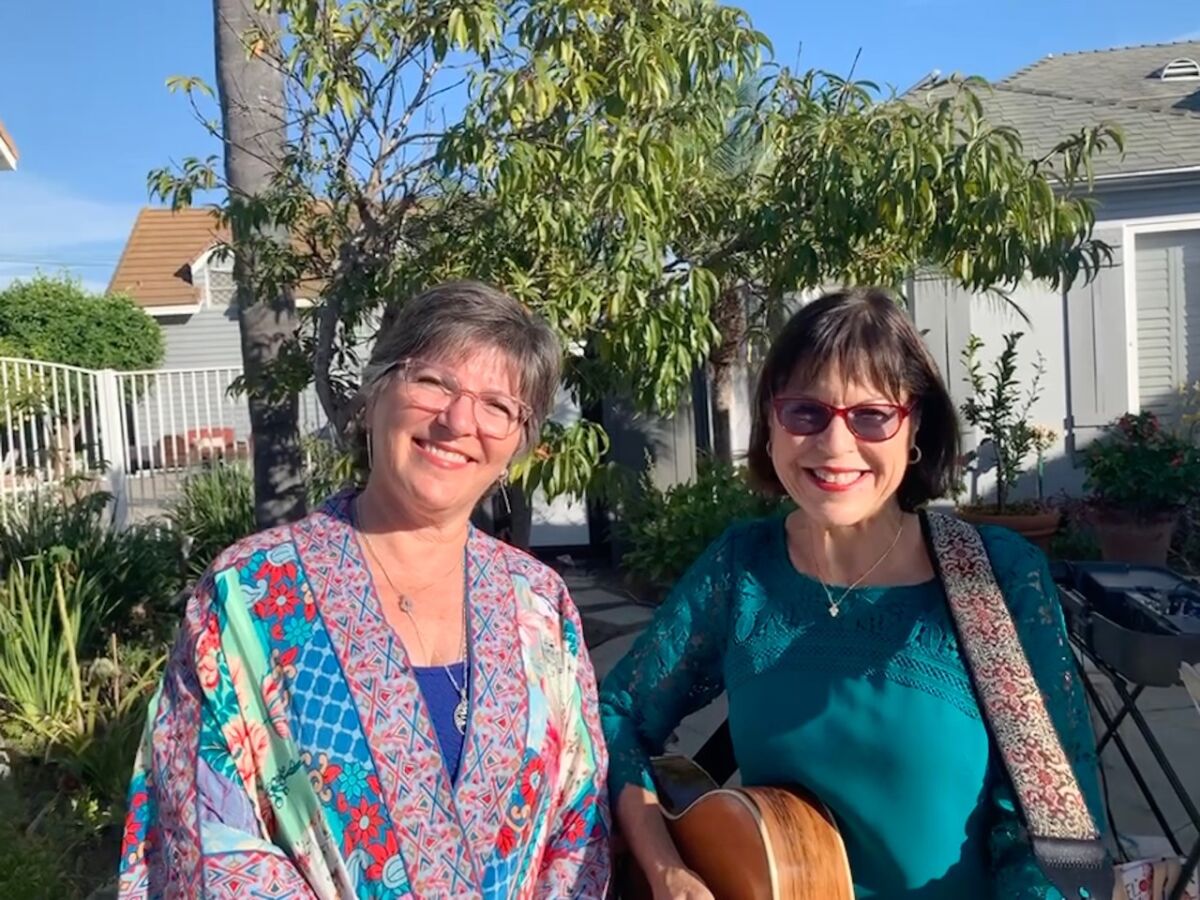 Susan Lipson, left, poses for a photo with guitarist Beth Faber Jacobs. The two will perform together on Dec. 3.