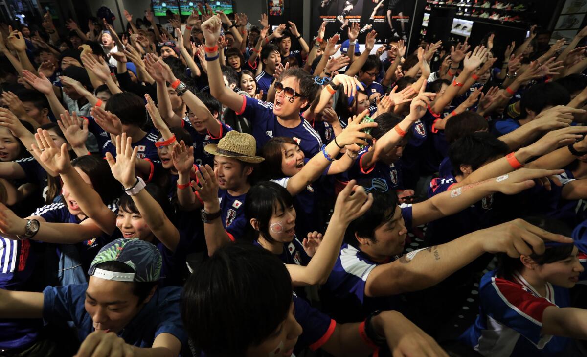 Japanese soccer fans, including these in Tokyo, had little to celebrate in losing to Ivory Coast in their World Cup opener on Saturday. But Japanese can be cheered by their country's high marks for economic competitiveness.