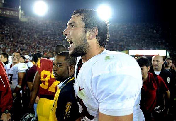 Stanford quarterback Andrew Luck celebrates after defeating USC, 56-48, in triple overtime at the Coliseum on Saturday.