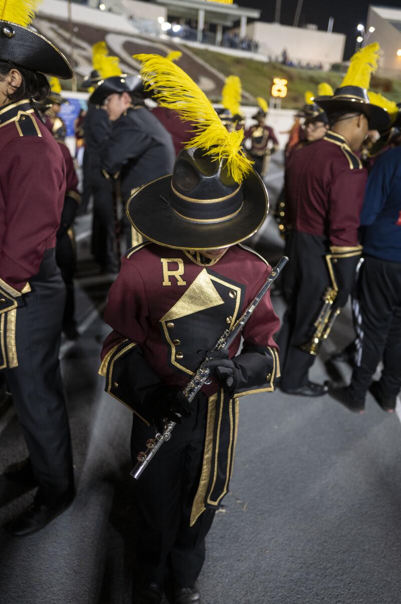 Cassandra Alvarado of the Roosevelt High marching band practices before her performance.