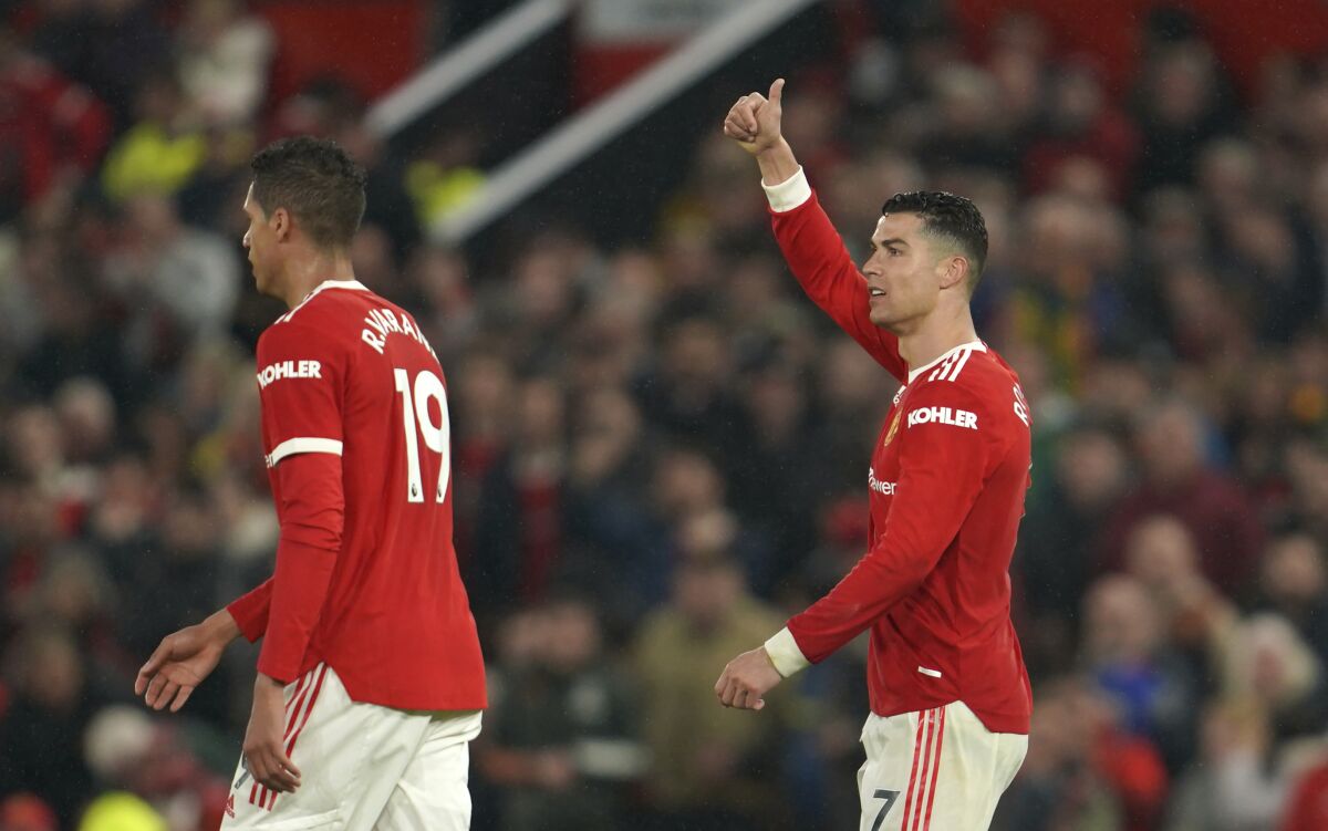Manchester United's Cristiano Ronaldo, right, reacts during the English Premier League soccer match between Manchester United and Brentford at Old Trafford Stadium in Manchester, England, Monday, May 2, 2022. (AP Photo/Jon Super)