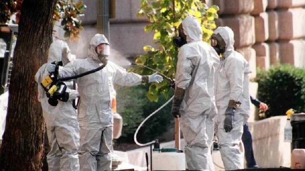 A hazardous materials worker is hosed down on Capitol Hill in October 2001. The mailing of anthrax-laced letters that fall gave momentum to the idea that the military needed defenses against biological threats.