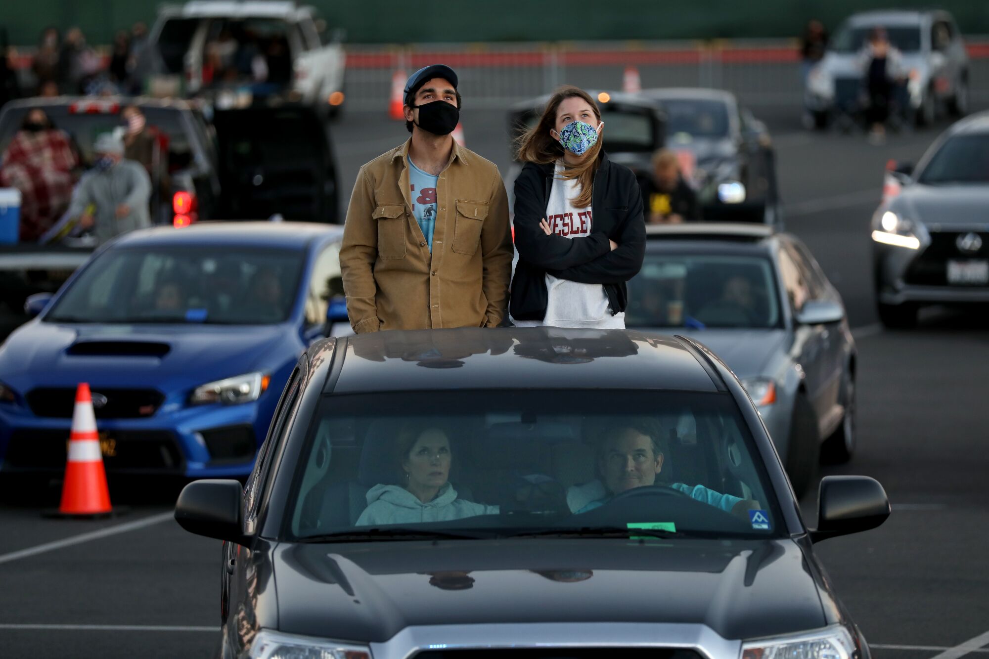 Concertgoers listen to Ozomatli at a Concerts in Your Car event at the Ventura County Fairgrounds on July 18, 2020.  