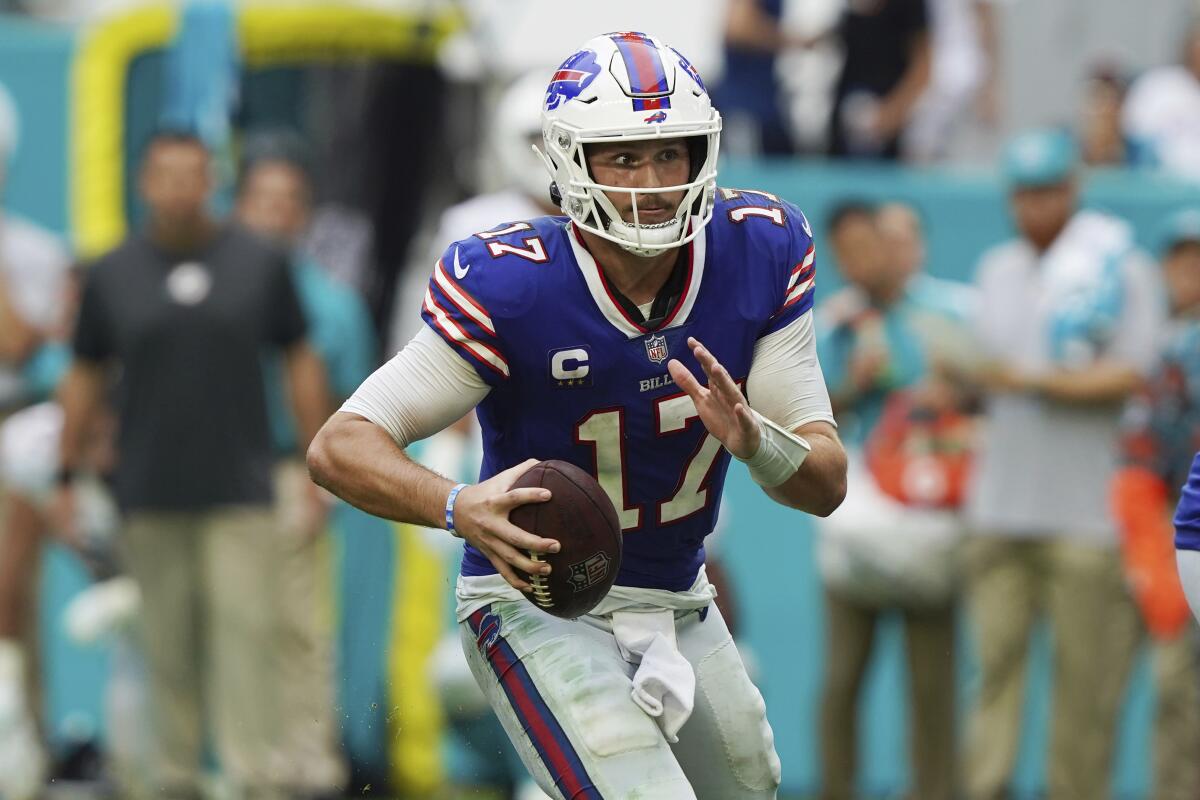 Buffalo Bills quarterback Josh Allen scrambles against the Miami Dolphins on Sunday.