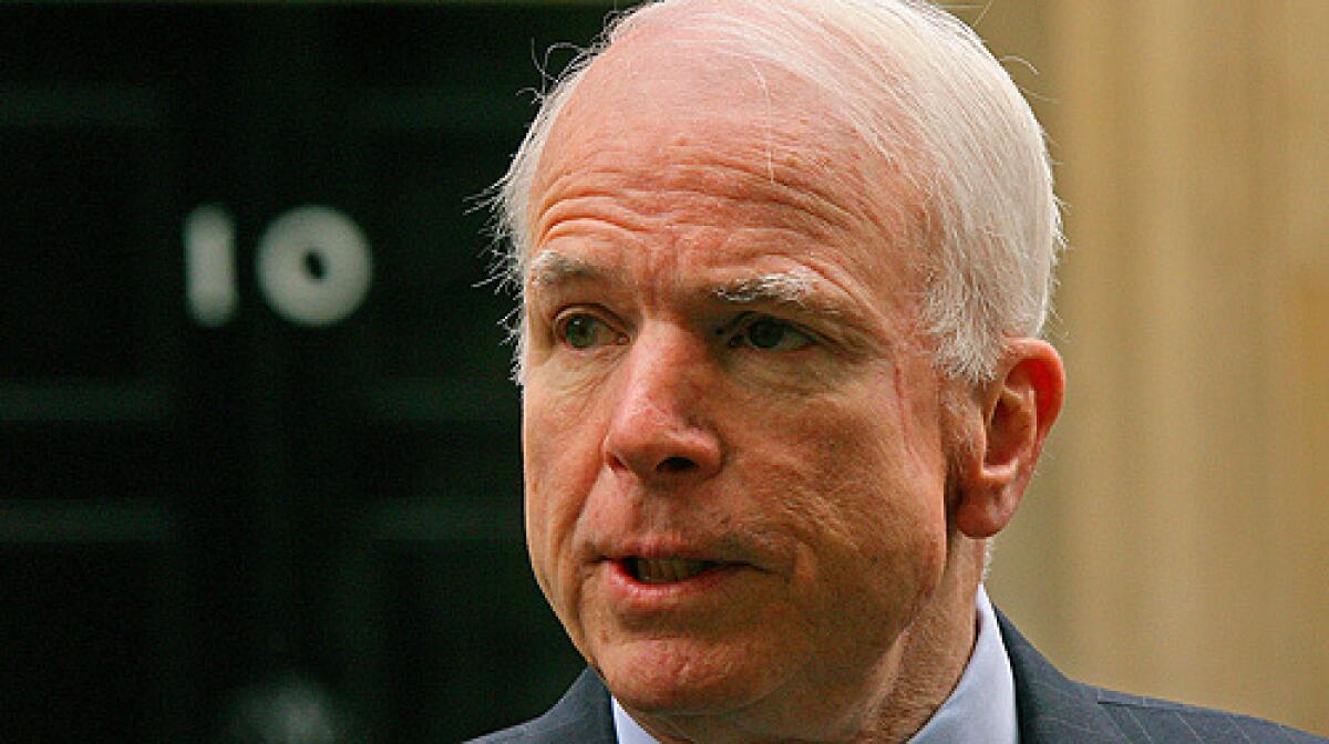 US Republican presidential candidate John McCain addresses the media outside 10 Downing Street in central London, on March 20, 2008, after a meeting with British Prime Minister Gordon Brown. A low-level staffer has been suspended from McCain's campaign in connection with sending out an unauthorized communication.