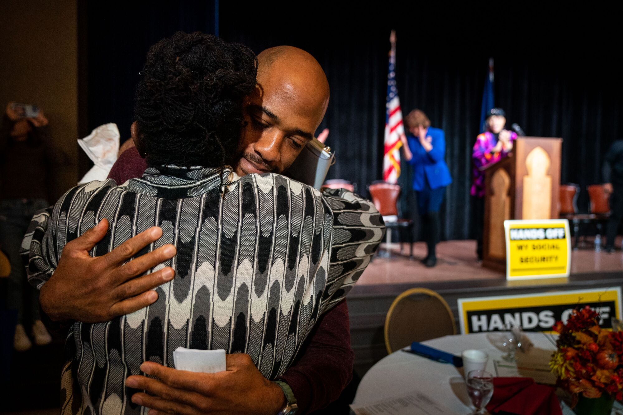 Mandela Barnes hugs Rep. Gwen Moore at an event