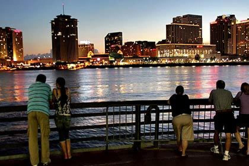 As lights flicker across the Mississippi River, tourists and commuters on the deck of the Canal Street ferry watch the sun set over New Orleans. This city, some experts say, has an opportunity few get: to rebuild from the ground up.
