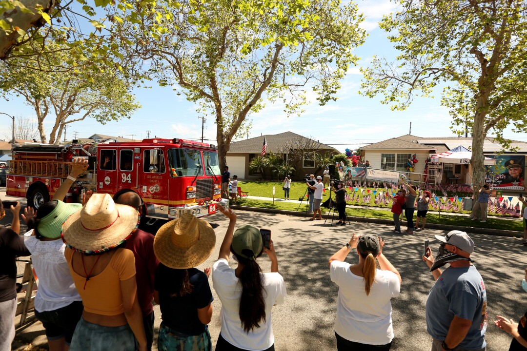 Firefighters, neighbors and well-wishers honor World War II veteran Lt. Col. Sam Sachs’ 105 birthday in Lakewood on April 26.