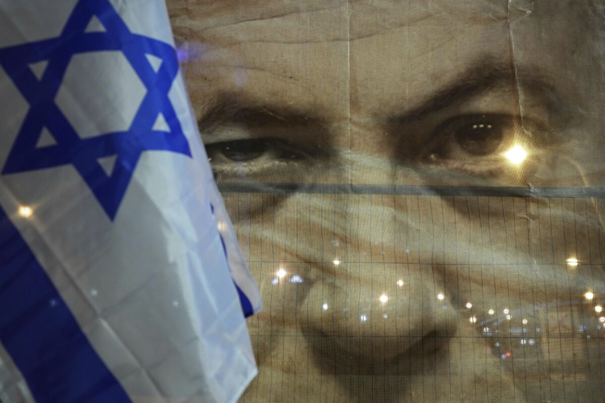 A banner depicting Israeli Prime Minister Benjamin Netanyahu is seen during a protest against his far-right government 