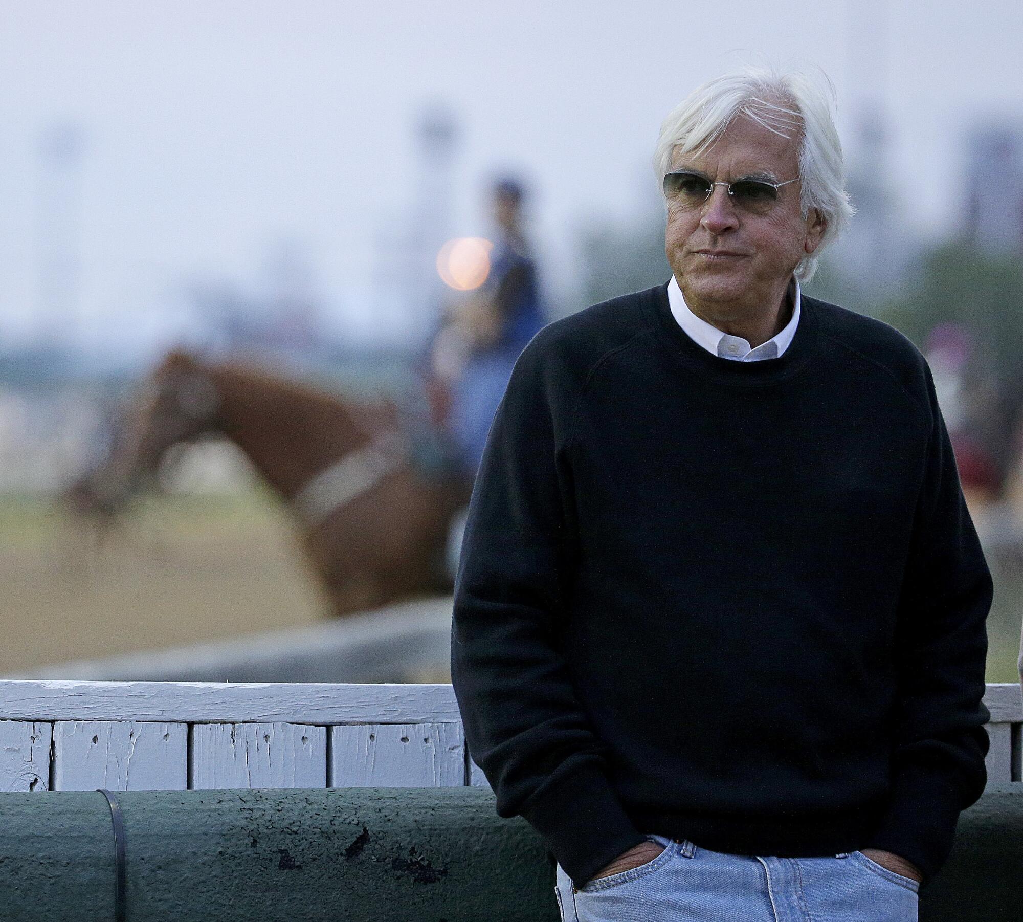 Bob Baffert looks on during training at Churchill Downs in 2016.