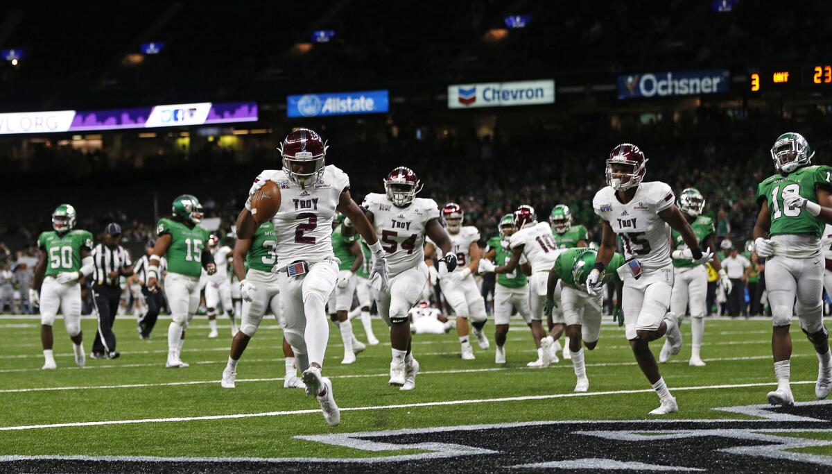 Troy wide receiver John Johnson crosses into the end zone for a touchdown in the second half of the New Orleans Bowl NCAA college football game against North Texas.