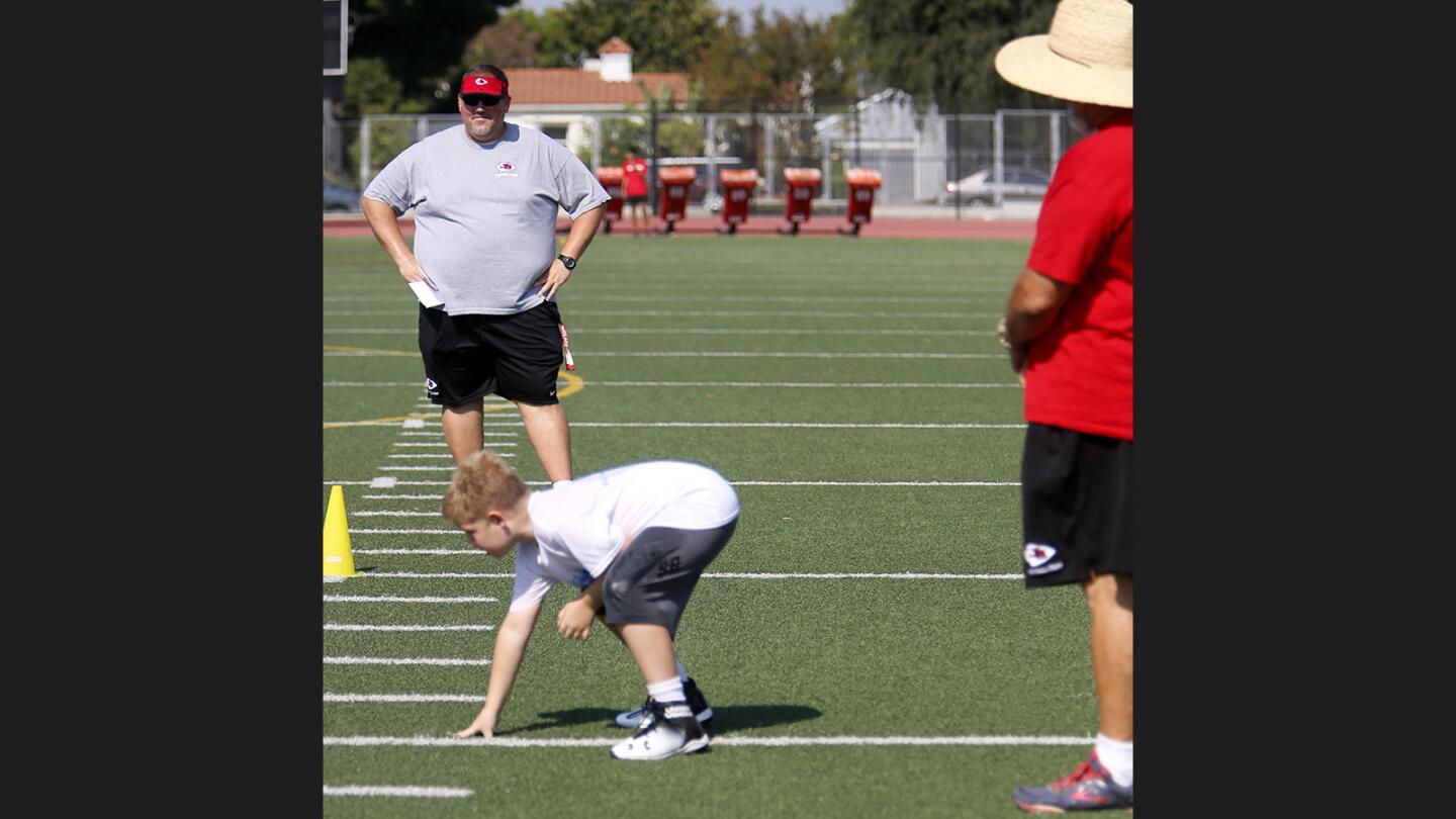 Photo Gallery: Football camp at Burroughs High School for six- to thirteen-year olds