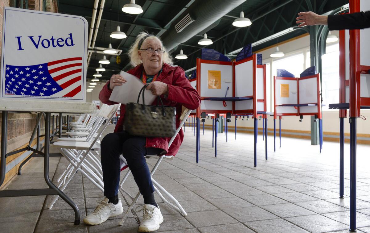 Margaret Collins of Ogden casts her ballot at Union Station during Utah's primary.