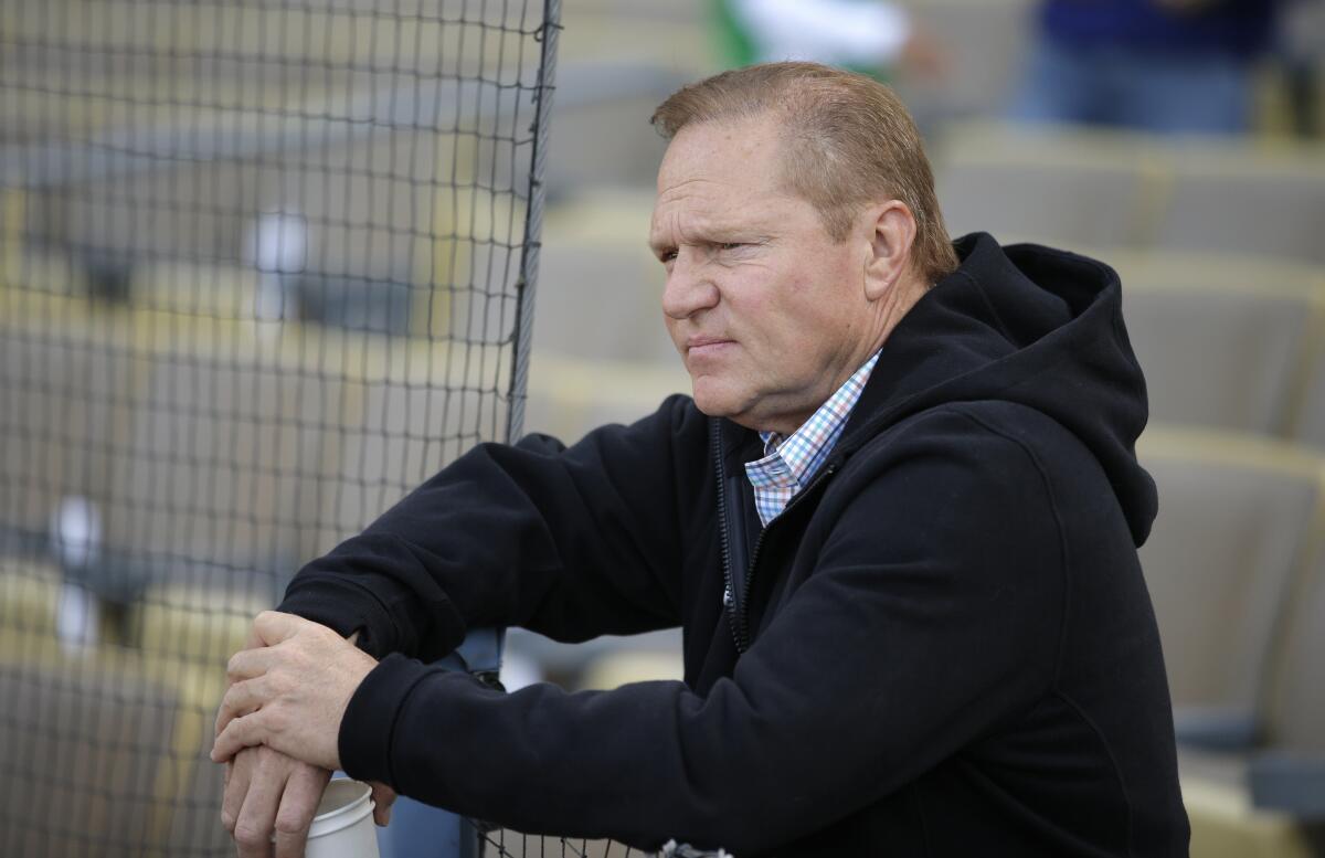 Sports agent Scott Boras watches the Miami Marlins players practice before a game against the Dodgers.