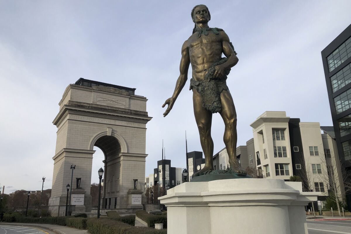 A statue depicting Chief Tomochichi, a Muscogee native who signed the 1733 Treaty of Savannah that launched the Georgia colony, pictured here on Dec. 20, 2021 in its temporary location outside Atlanta's Millennium Gate Museum. Plans for Atlanta's Peace Park include installing the statue atop a 110-foot high pedestal where it would tower over statues of the Rev. Martin Luther King Jr. and other civil rights leaders. (AP Photo/Michael Warren)