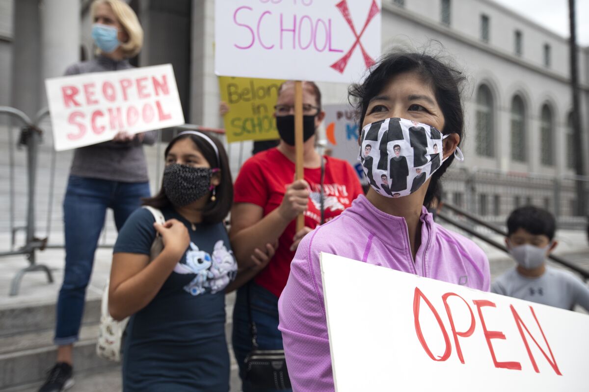 An "Open Our Schools Rally" at City Hall in October.
