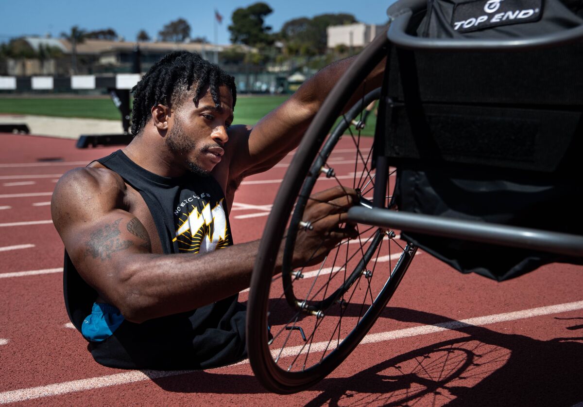 Zion Clark in San Diego preparing his chair for a training session for the Paralympic Trials in Minneapolis.