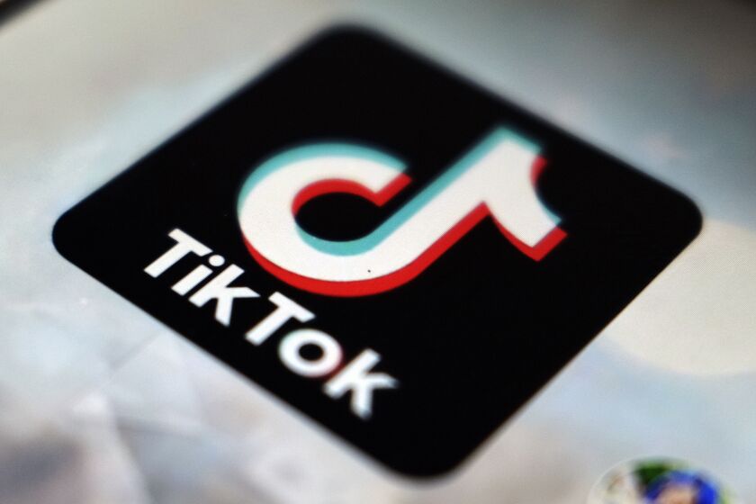 FILE - This photo shows a TikTok app logo in Tokyo on Sept. 28, 2020. In the latest salvo in the battle over the Chinese-owned video sharing app, Beijing says a ban on the use of TikTok by official European Union institutions will harm business confidence in Europe. (AP Photo/Kiichiro Sato, File)