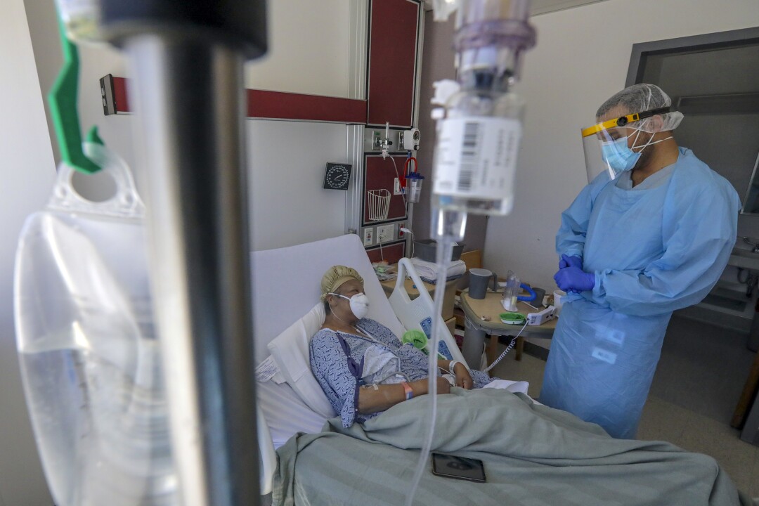 A patient's return to hospital COVID-19 unit underscores
uncertainty to come 2 Dr. Imran Siddiqui