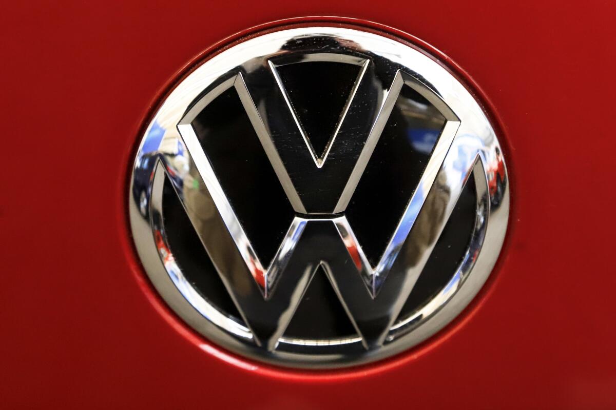 FILE - This Feb. 14, 2019, file photo, shows the Volkswagen logo on an automobile at the 2019 Pittsburgh International Auto Show in Pittsburgh. The U.S. government’s road safety agency has opened two investigations into problems with Volkswagen vehicles, including one that alleges serious gasoline leaks under the hood. Details of the probes covering nearly 215,000 vehicles were posted Friday, April 2, 2021, on the National Highway Traffic Safety Administration website. (AP Photo/Gene J. Puskar, File)