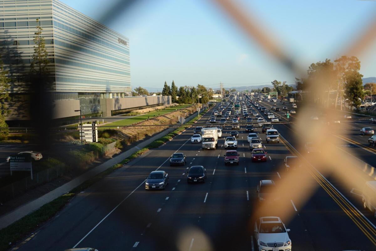 Prime real estate and relatively cheap land encouraged big-name companies such as Hyundai, at left beside the 405 Freeway, to bring their headquarters and hundreds of jobs to Fountain Valley, city staff says.