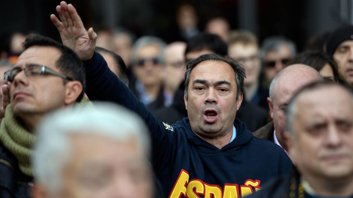 Far-right Falange members perform the fascist salute during a demonstration marking the anniversary of the death of Spanish dictator Francisco Franco in Madrid on Nov. 18.