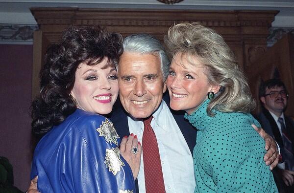John Forsythe is joined by castmates Joan Collins, left, and Linda Evans at a party celebrating the production of 150 episodes of the popular series. See full story