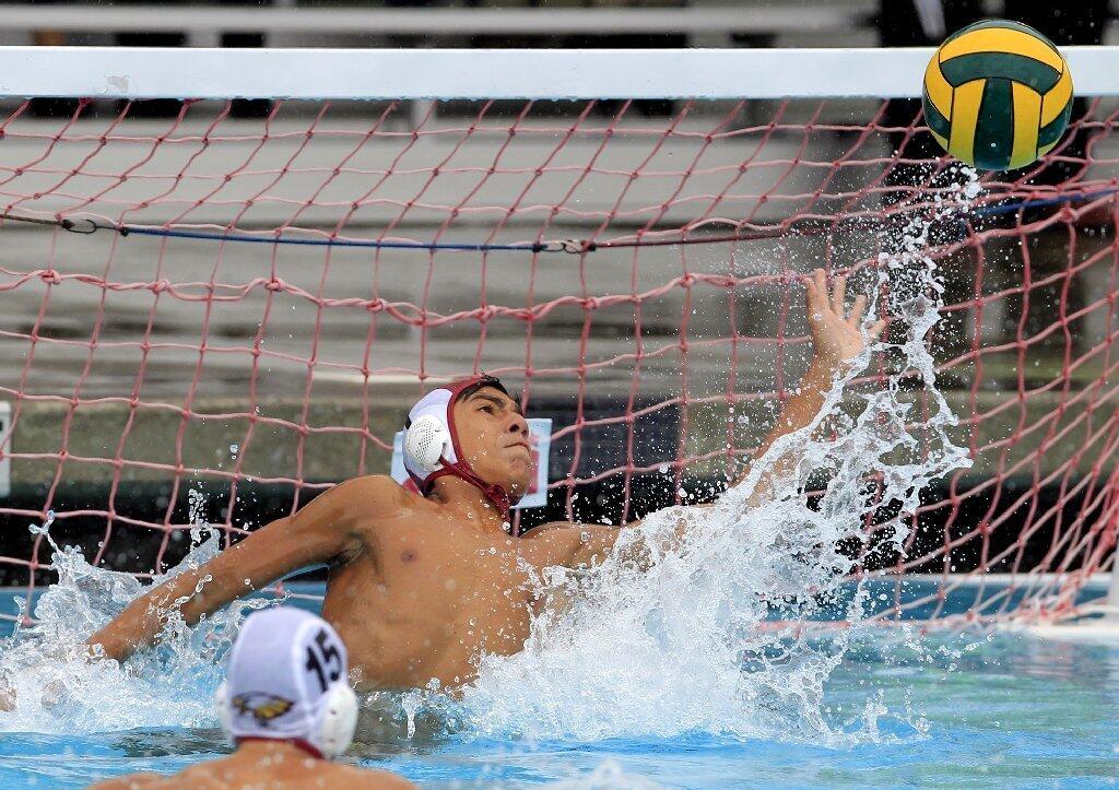 Estancia High goalie Cesar Coto defends at the net during the first half against Costa Mesa in an Orange Coast League game on Wednesday.