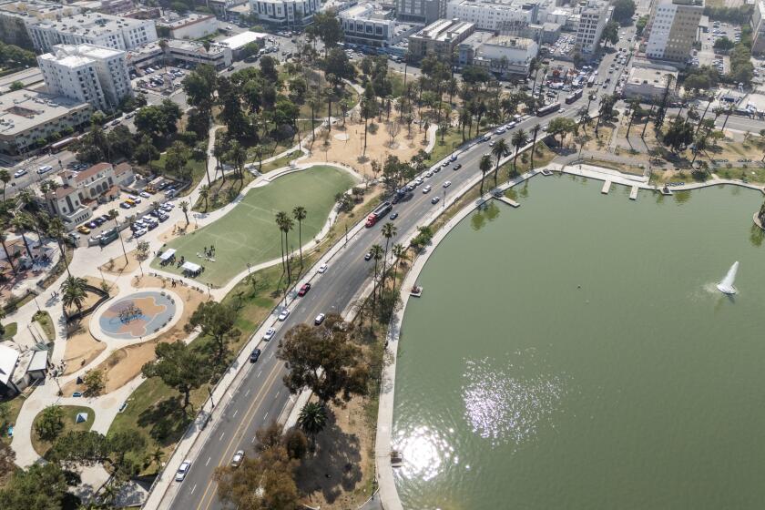 LOS ANGELES, CA - JULY 09: The first phase of the "Reconnecting MacArthur Park" project was announced at MacArthur Park in Los Angeles, CA on Tuesday, July 9, 2024. This first phase will study the feasibility of permanently closing Wilshire Boulevard (pictured), which splits the park, to vehicular traffic in favor of an "open streets" concept. (Myung J. Chun / Los Angeles Times)