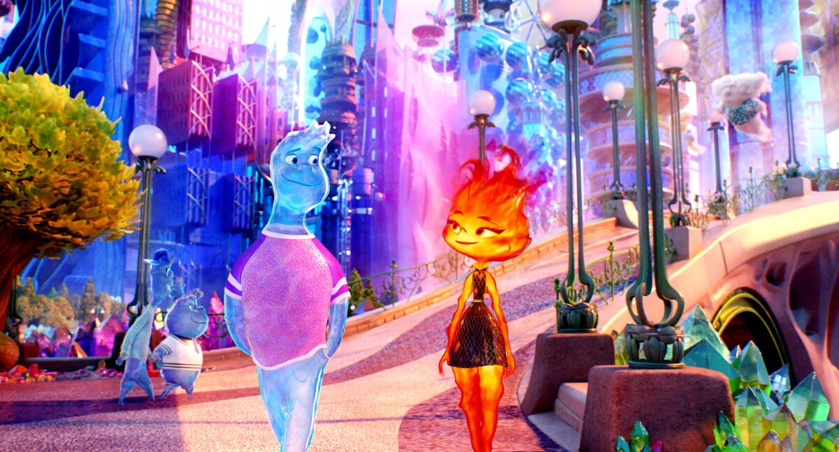 An animated person made of water and a person made of flames walk through an imaginary city in the Pixar film 'Elemental.'