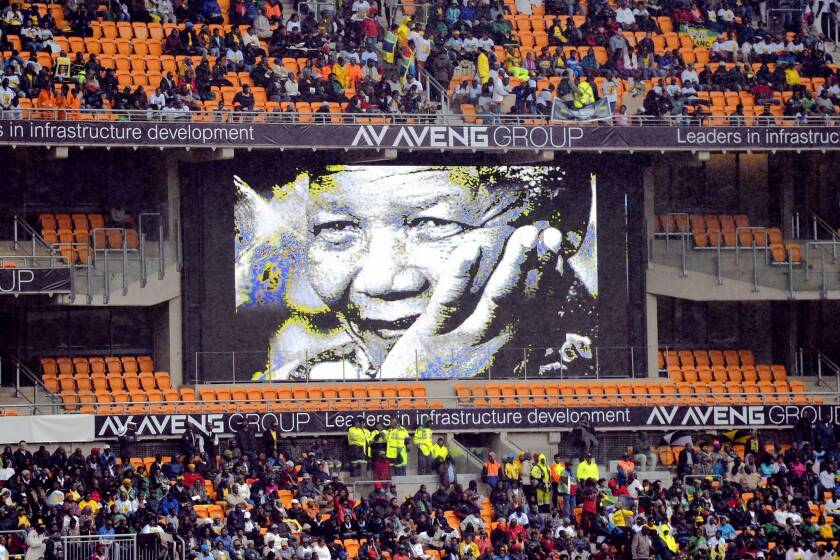 A screen shows former South African President Nelson Mandela during his memorial service at the FNB Stadium in Johannesburg.