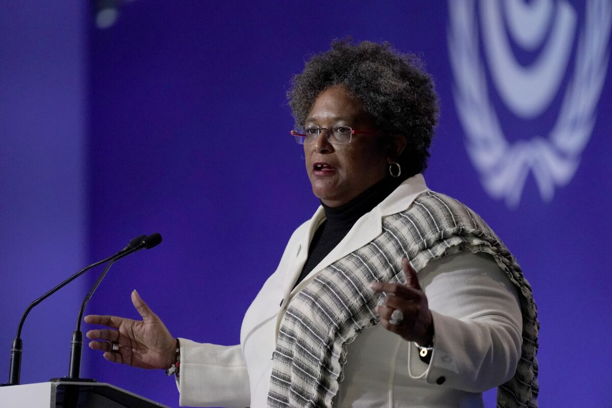 FILE - Barbados Prime Minister Mia Amor Mottley speaks during the opening ceremony of the COP26 U.N. Climate Summit, in Glasgow, Scotland, Nov. 1, 2021. The eastern Caribbean island of Barbados is holding a snap general election on Jan. 19, 2022, more than a year ahead of schedule, and Mottley is seeking a second term for a five-year position she won in 2018, when she became the island’s first female leader. (AP Photo/Alberto Pezzali, File)