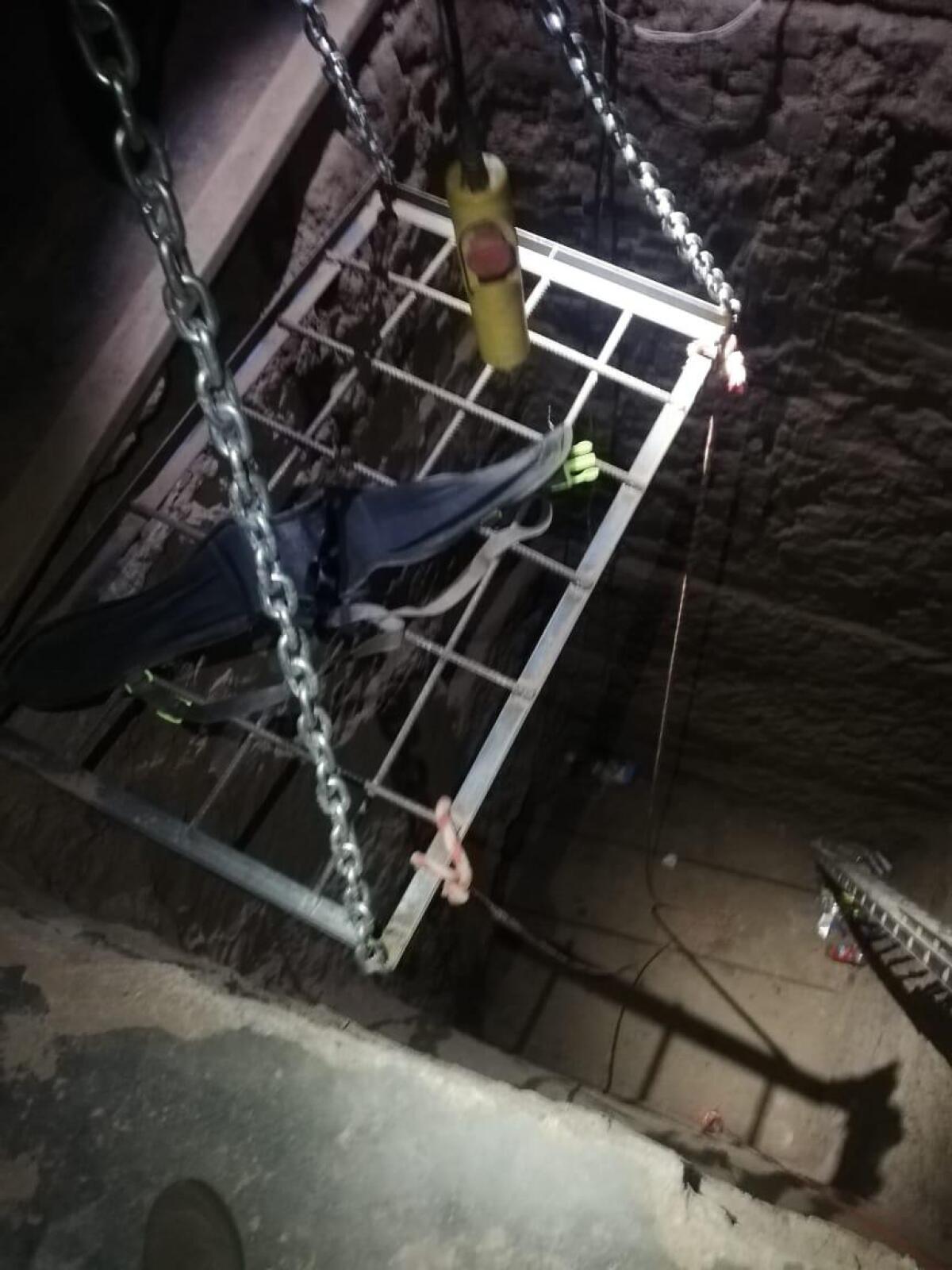 A  subterranean tunnel in Mexicali shows an electric hoist