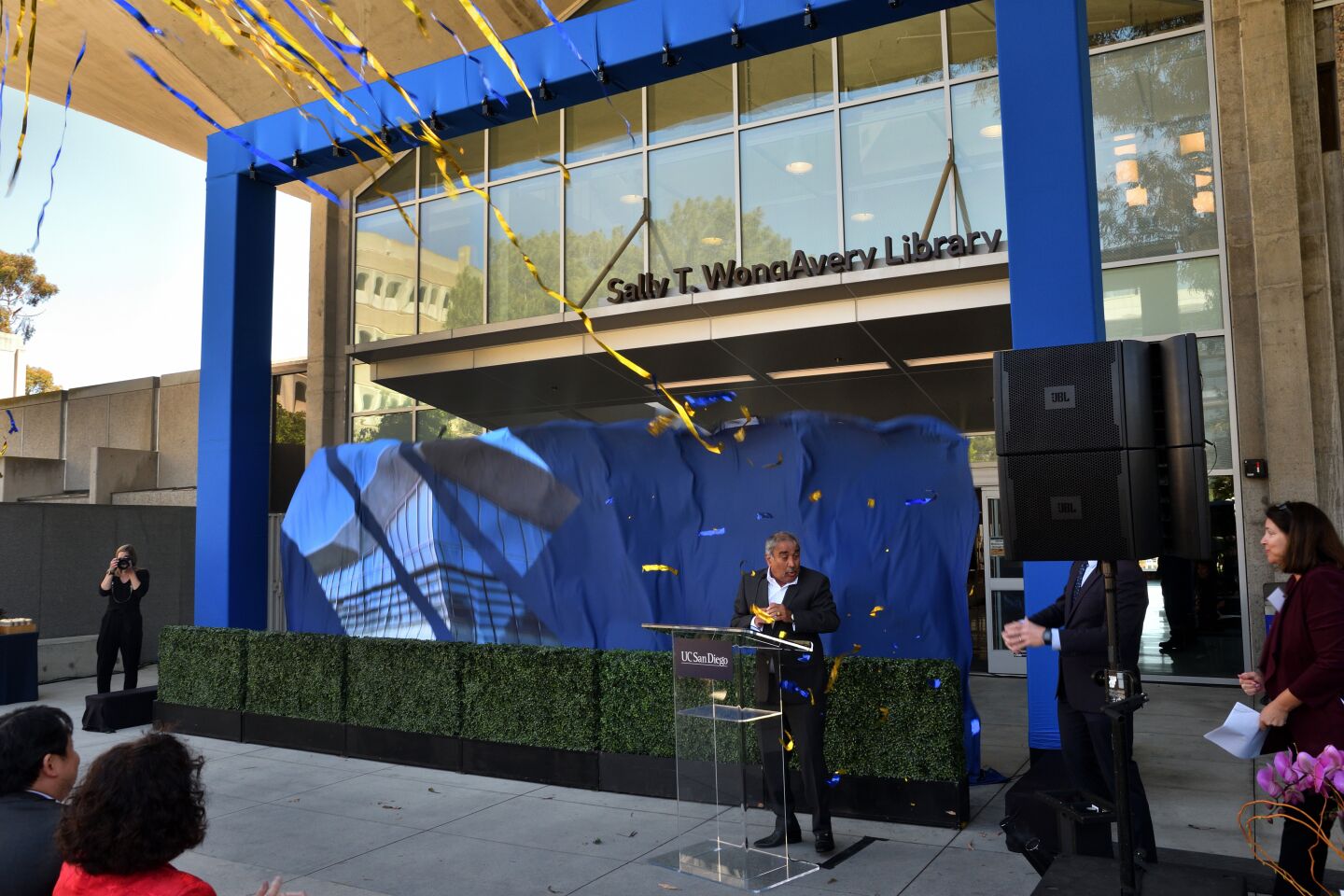 The curtain drops to reveal the newly dedicated Sally T. WongAvery Library, the former Biomedical Library at UC San Diego in La Jolla.