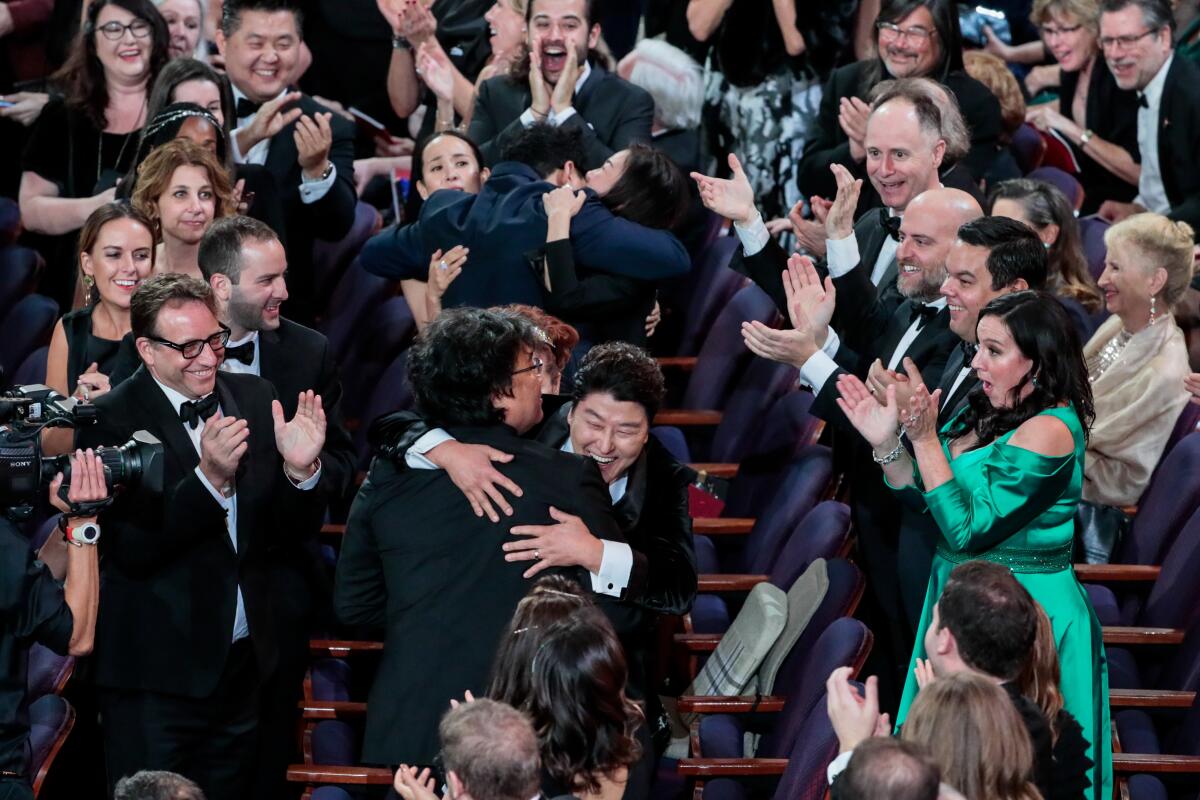 Song Kang Ho and director Bong Joon Ho celebrate winning the best picture Oscar for “Parasite” during the telecast of the 92nd Academy Awards.