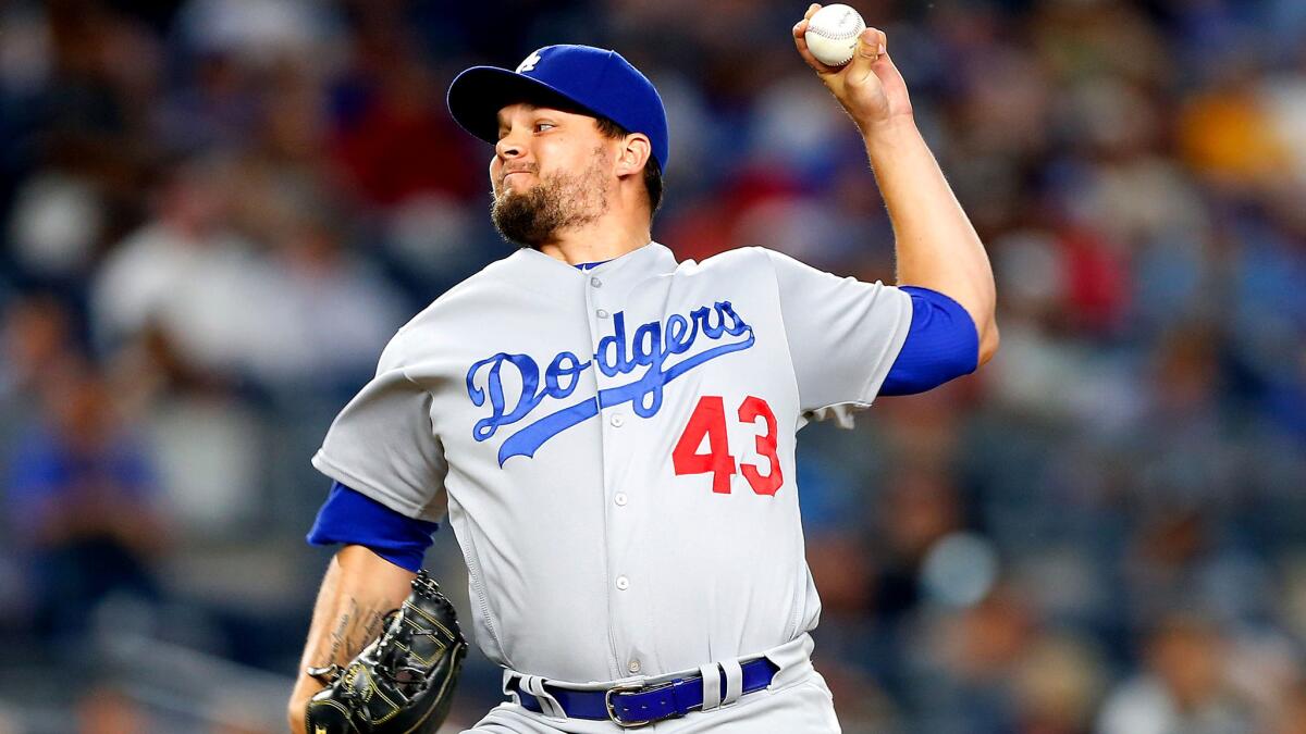 The Dodgers opted to have left-handed reliever Luis Avilan, above, on the postseason roster instead of starter Alex Wood.