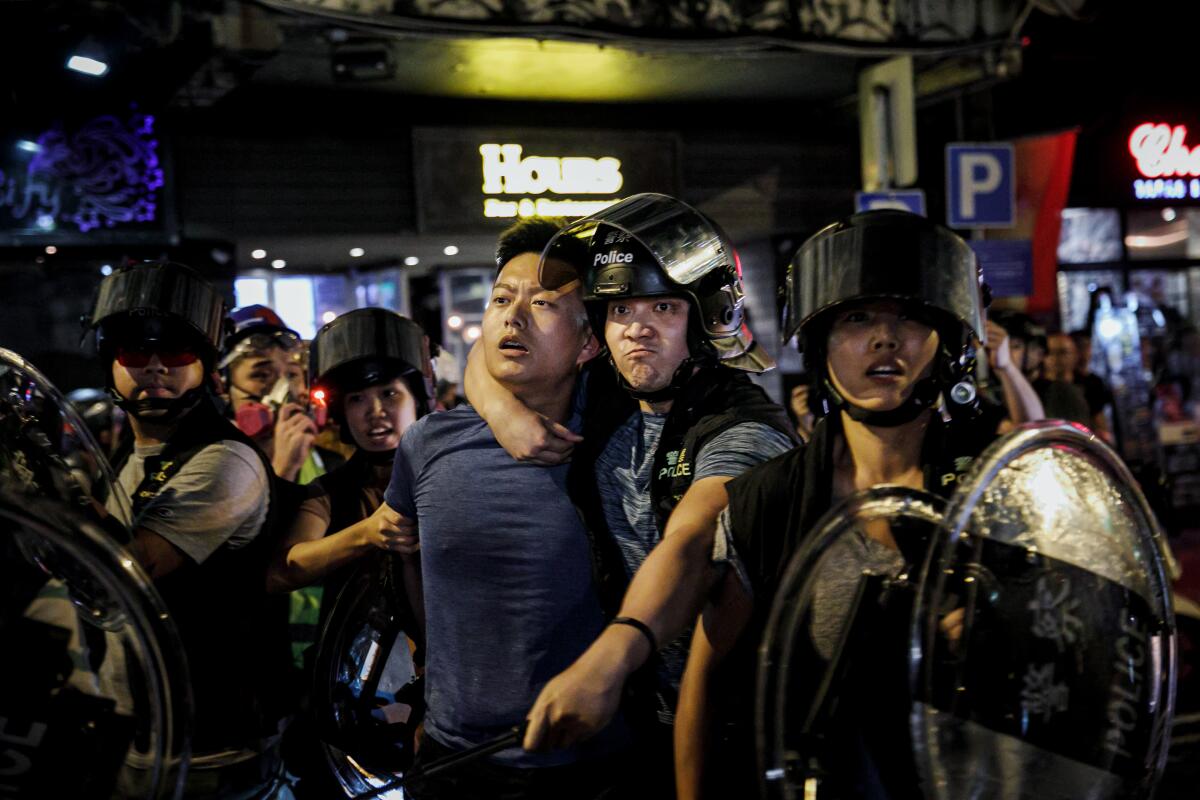 Hong Kong police arrest a protester